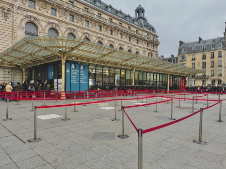 A view of the Louvre pyramid at dusk, a symbol of classical art history.