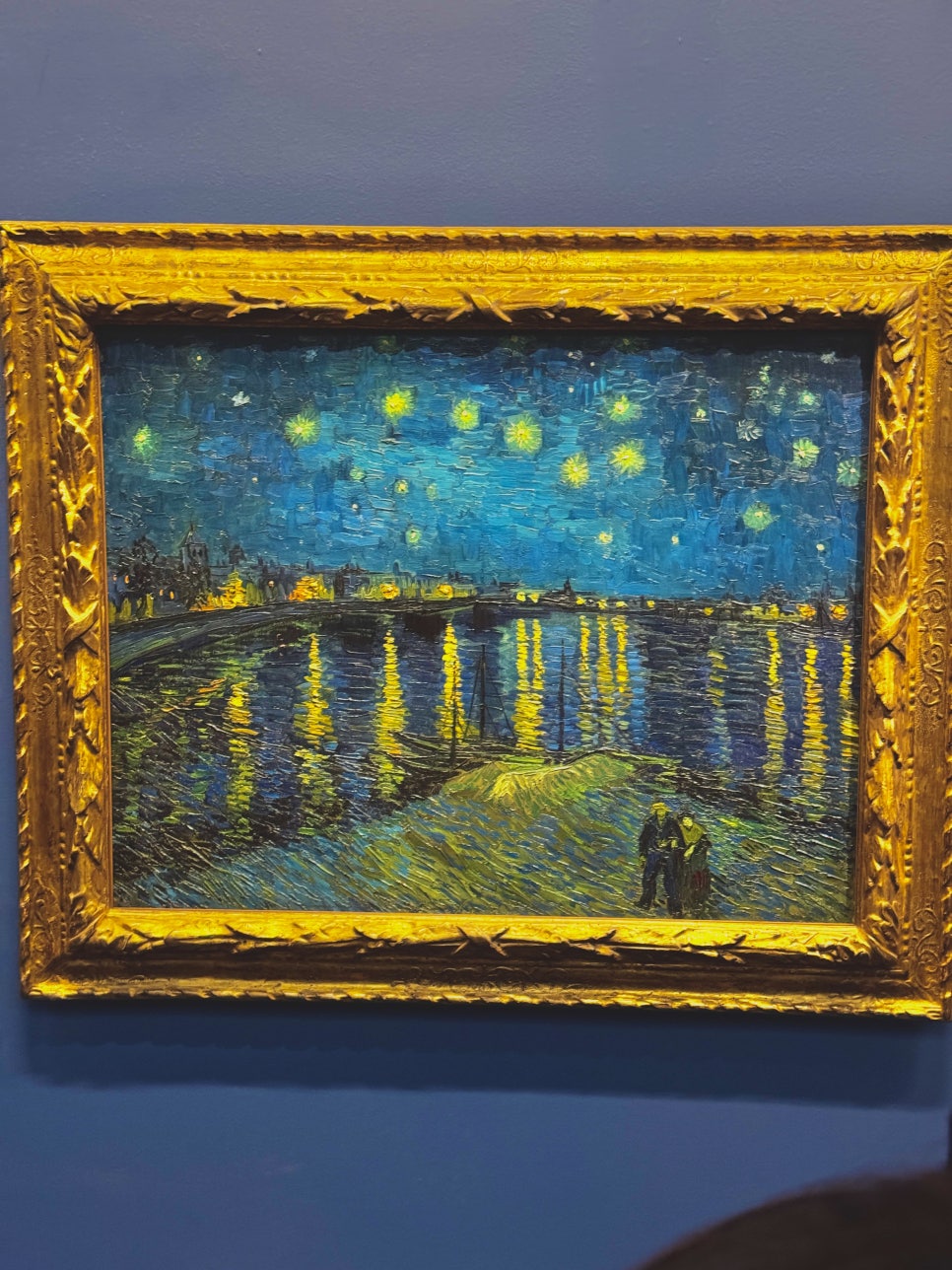 Vincent van Gogh's 'Starry Night Over the Rhône' on display, showing its brilliant blues and yellows.