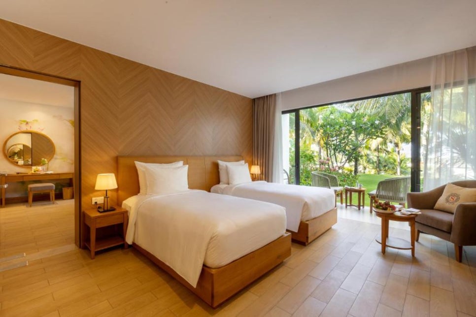 Modern and clean bedroom with a large bed and ocean view